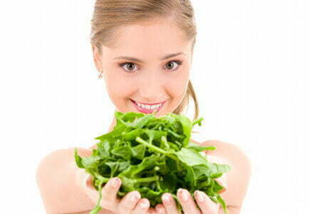 picture-of-happy-woman-with-spinach-over-white-3