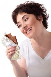 woman-staring-at-a-piece-of-chocolate-200x300-3675629